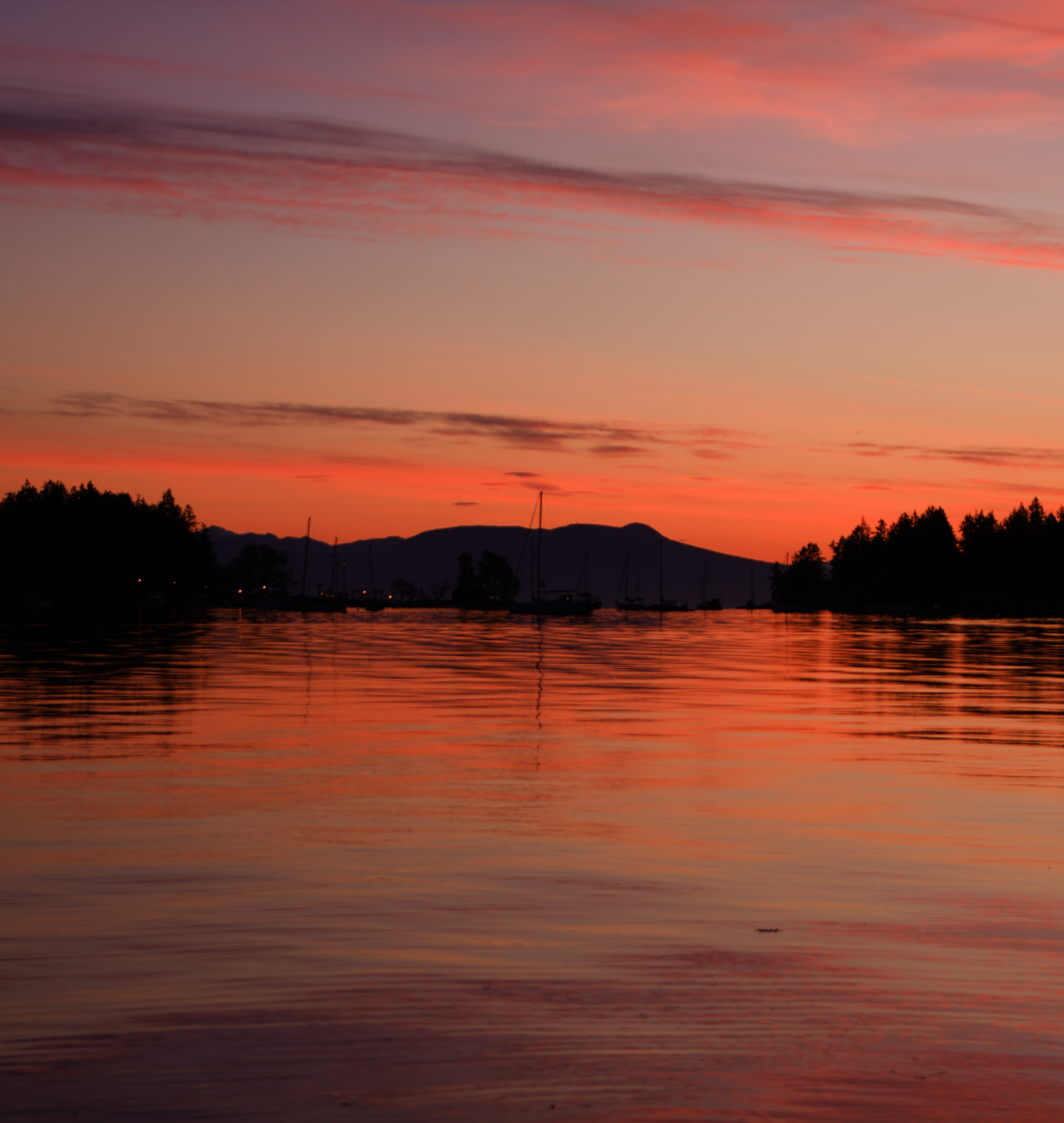 Boats on the water in a sunrise